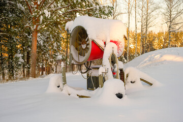 A snow gun that sprays artificial ice crystals. Snow making machine. For the pleasure of skiers - Powered by Adobe