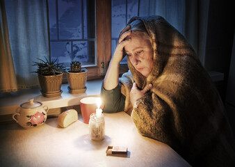 Woman with candles. Power outage in Kyiv