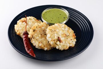 Sabudana vada or Sago fried pan cake served with peanut chutney a popular fasting food in India.
