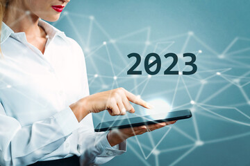 2023 text with business woman using a tablet