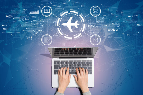Flight ticket booking concept with person using a laptop computer