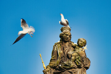 Statue of the Madonna attending to St. Bernard on  Charles bridge, Prague. Czech Republic.