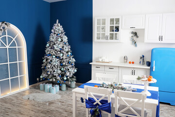 For the New Year and Christmas holidays, the room is decorated with a Christmas tree. Christmas celebration.