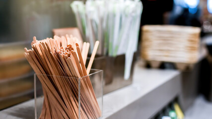 Wooden mixing sticks in coffe shop