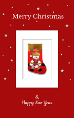 Christmas card with a red gift sock and a snowman in a red checkered hat on a red backdrop. The sock is in the white frame and there're are stars and snowflakes around. It can be used in print, web...
