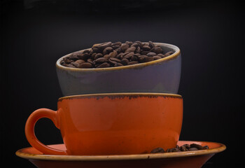 Coffee beans in two cups standing in a row. Coffee bean and coffee presentations. Coffee cup and decorative contents. Beverage culture. Beverage background. Menu images. banner. isolated.