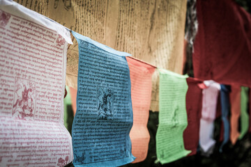 Tibetan Buddhist prayer mantra flags hang in the Himalayan Mountains of Tibet
