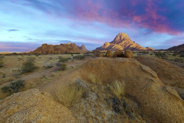 Sunrise in calm morning in Spitzkoppe, panoramic, desert landscape of famous red, granite rocks, Namibia, Africa 