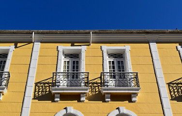 Balconies on yellow facade, downtown Petropolis, Rio de Janeiro