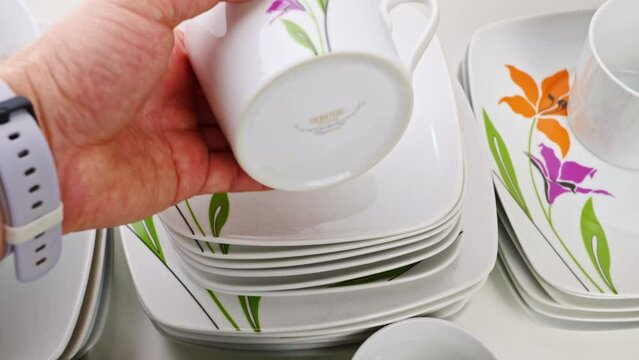 cups and plates with the image of flowers 