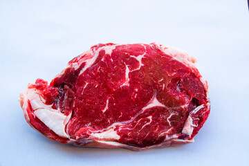 Obraz premium Fresh beef ribeye slice on white background.