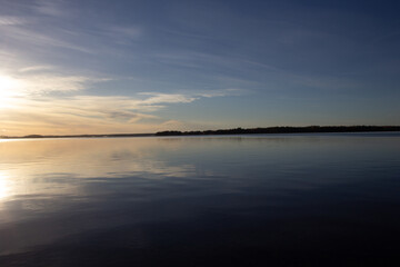 Fototapeta na wymiar Beautiful lake scenery with sunrise