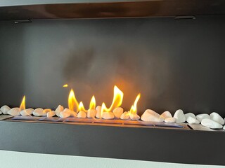 burning candles in a fireplace