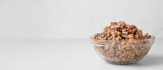Bowl of traditional Ukrainian kutya dish on light background with space for text