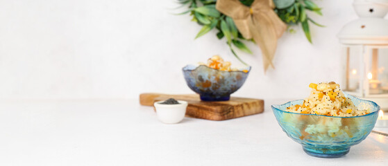 Bowl of traditional Christmas kutya dish on light background with space for text