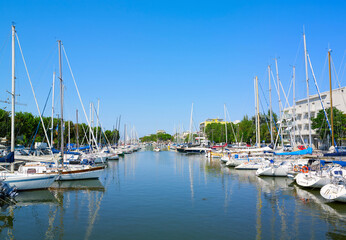 Fototapeta na wymiar View of Rimini sea port with yachts and blue water.