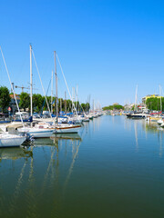 Fototapeta na wymiar View of Rimini sea port with yachts and blue water.