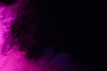 Pink smoke on black background