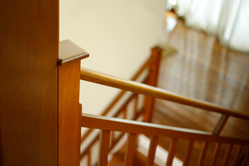 Fototapeta na wymiar detail of wooden handrail on stairs