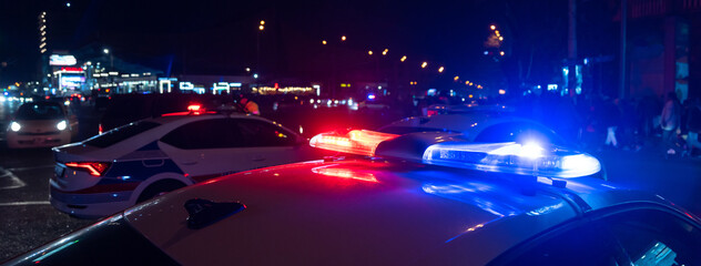 Police car with flashing lights on © Daniel