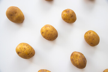 Buch of whole potatoes on white background