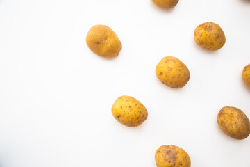 Buch of whole potatoes on white background