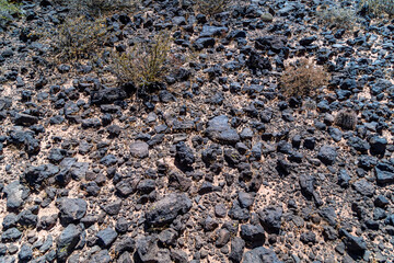 black lava stones in mountain terrain in south america