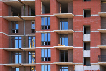 Fototapeta na wymiar Construction site. High rise Building under construction. Construction of high-rise residential building