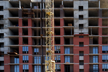 Construction site. High rise Building under construction. Construction of high-rise residential building