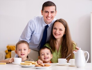 Obraz na płótnie Canvas Happy family having breakfast together at home