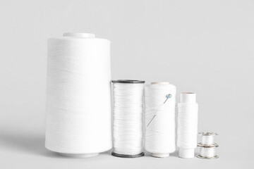 Different thread spools isolated on white background