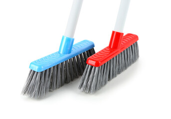 Cleaning brooms isolated on white background, closeup