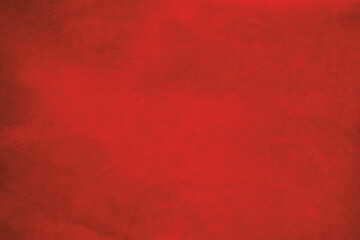 The background is red suede. The texture of suede leather dyed red.