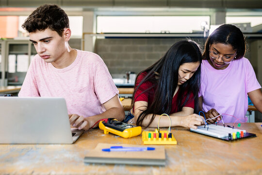 High school multi-ethnic teenage students learning electronics at lecture class