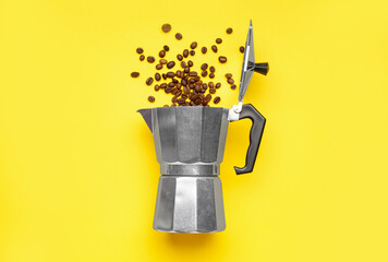 Geyser coffee maker with scattered beans on yellow background