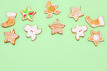 Composition with tasty Christmas cookies on green background