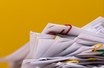 Stack of Group report papers Document on yellow background.