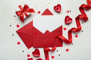 Blank letter with gift and hearts on white background. Valentine's Day celebration