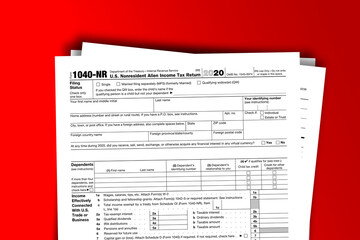 Fototapeta premium Form 1040-NR documentation published IRS USA 44409. American tax document on colored