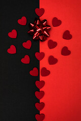 Black and red background decorated with a red bow and red hearts, a banner for discounts or congratulations