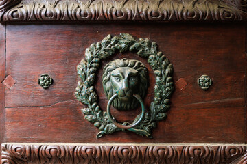 Antique decor on the front doors. Background with selective focus and copy space
