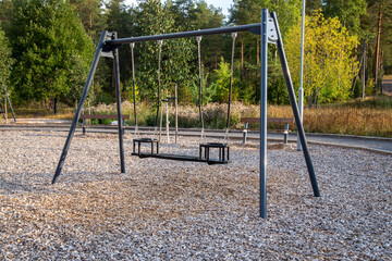 Empty swings for children at playground