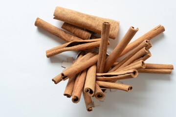 odd shaped cinnamon sticks on blank paper