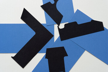 blue cards and abstract black paper shapes