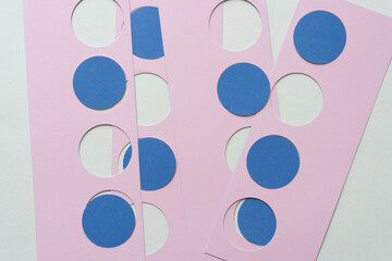 abstract pink and blue dots or circles and stencils with circle cutouts