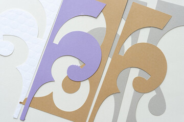 brown, gray, white, and purple elegant decor shapes on blank paper