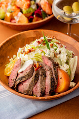 Steak Salad. Kale, chopped mixed greens, grilled chicken, fresh strawberries, cheese, walnuts, almonds mixed with olive oil, balsamic vinegar seasoned w/ salt & pepper. Classic takeout favorite.
