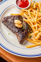 Steak. Grass-fed skirt steak, grilled to a medium rare and served with a garlic herb butter sauce and paired with roasted potatoes and Brussels sprouts. Classic American steakhouse favorite.
