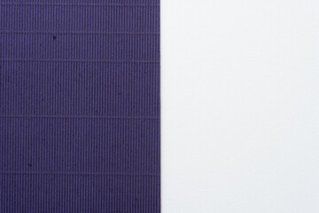 deep purple corrugated paper and white background