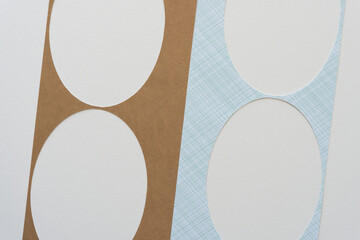 set of oval paper frames on blank paper